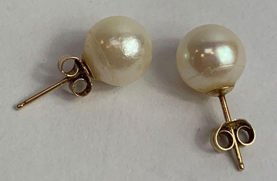 A pair of cultured pearl ear studs, approximately