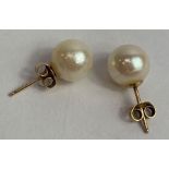 A pair of cultured pearl ear studs, approximately