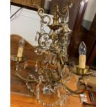 A 20th century ornate three branch chandelier, wit