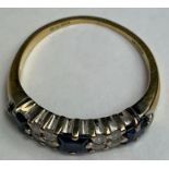 An 18 carat gold sapphire and diamond half hoop ri