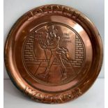 A Johnnie Walker coppered round tray with embossed