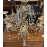 A 20th century eight branch brass chandelier