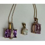 An amethyst and diamond pendant on a chain; with a