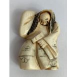 A 19th/20th century Japanese ivory netsuke in the