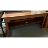 A 20th century pitch pine table, with carved legs,