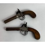 A pair of early 19th century pin fire pistols, eac