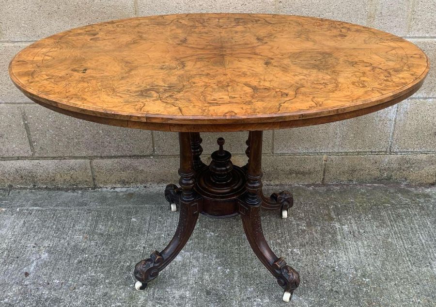 A Victorian walnut loo table, 69cm high, 104cm lon