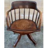 A 20th century captains chair, with an inlaid seat
