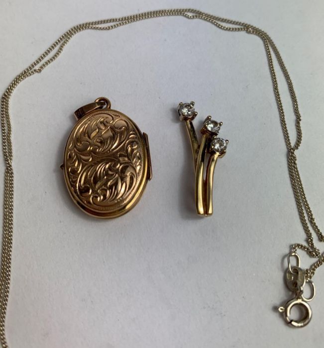 A 9 carat gold oval locket pendant; with a 9 carat - Image 2 of 2