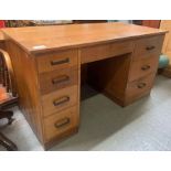 A 20th century oak desk, set with a single long dr