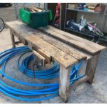 Large wooden work bench with vice