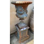 Large decorative cast iron urn planter on base