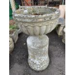 Reconstituted stone urn planter on large base