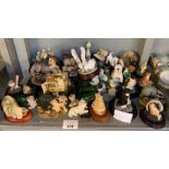 Collection of ceramic animals on wooden bases