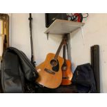 2 acoustic guitars & guitar cases and a music stan