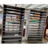 A pair of industrial metal workshop counter top shelves