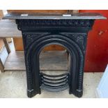 Black painted iron fire surround with decoration