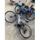 White full suspension bicycle + 1 other