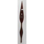 A carved and pierced hard wood paddle, 139cms long