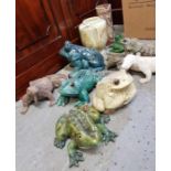 A collection of model frogs, lizards and other