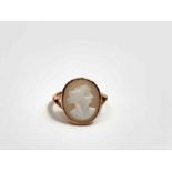 An oval cameo ring, with split shoulders, the shan