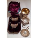 A pair of silver salt cellars and spoon, along w