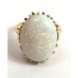 An 18 carat gold opal single stone ring, the oval ca