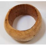 A heavy carved bone disc