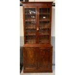 An early 20th century mahogany two section bookcas