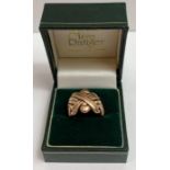 A puzzle ring, unmarked, finger size N, 11.6 grams