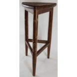 A mid 20th century teak stool, the unusually shape