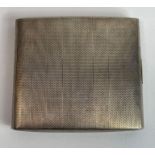 A silver cigarette case, engine turned decoration,