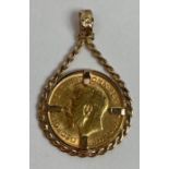 A 1913 half sovereign in a 9ct gold pendant mount