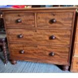 A Victorian mahogany veneer chest of two short and