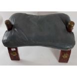 A 20th century camel saddle style stool, with stai