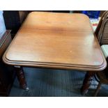A Victorian mahogany extending table, on turned le