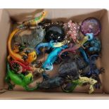 A collection of lizard and frog figures, various s