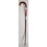 A malacca walking cane with 9ct rose gold band, 92