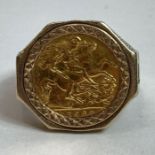 A 1982 half sovereign in a 9ct gold ring mount wit