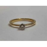 A round brilliant cut diamond solitaire in a six c