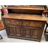 An early 20th century oak sideboard, with two