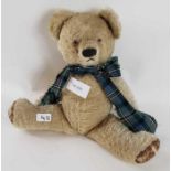An early 20th century jointed teddy bear, stitched