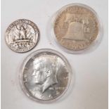 A 1951 half dollar, a 1964 half dollar and a 1944