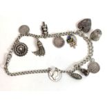 A silver Albert chain with various charms attached,