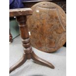 A 18th century tilt top table, with a carved top, stan