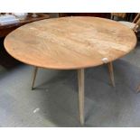 An Ercol drop leaf table on splayed legs, 69cm