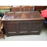 An 18th century dark oak coffer of usual form, the