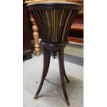 A 20th century mahogany plant stand, on splayed le