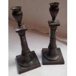 A pair of pewter Swedish candlesticks, the bass st