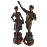 A pair of spelter figures of a male and a female,